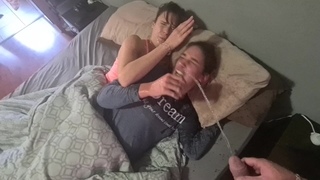 Two girls getting woken up with piss in their faces and starts pissing in their pajamas afterwards