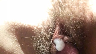 the most wonderful hairy cunt with cum on her clit