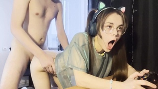 Schoolgirl with ponytails fucks and plays a video game