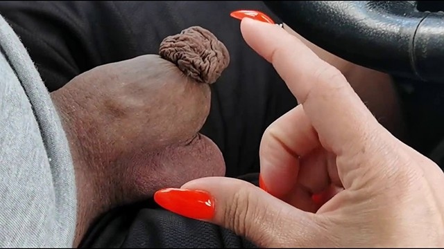 The girl plays with the driver's small cock with disgusting phimosis